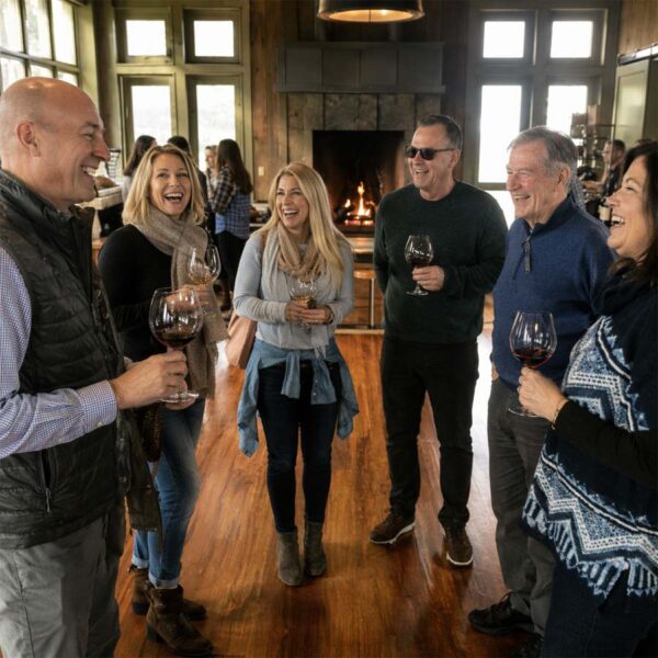 Group of guests enjoying a private wine tasting during a Willamette Valley wine tour
